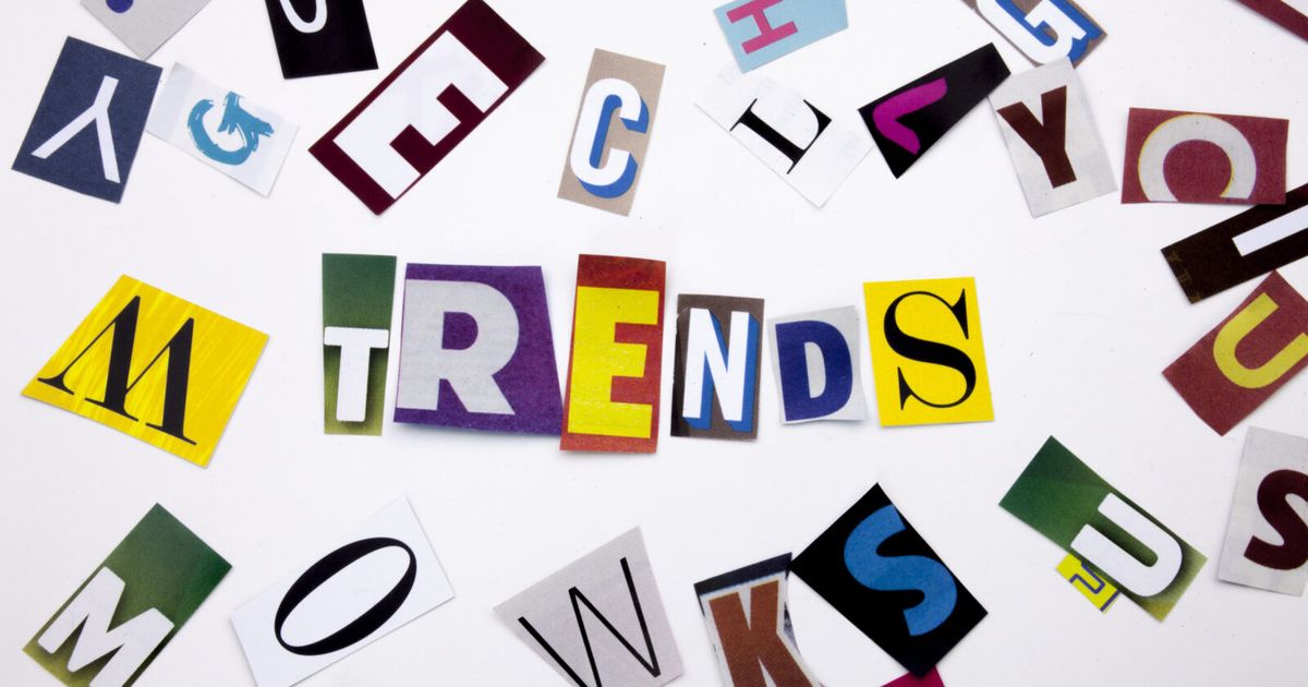 A word writing text showing concept of TRENDS made of different magazine newspaper letter for Business case on the white background with copy space